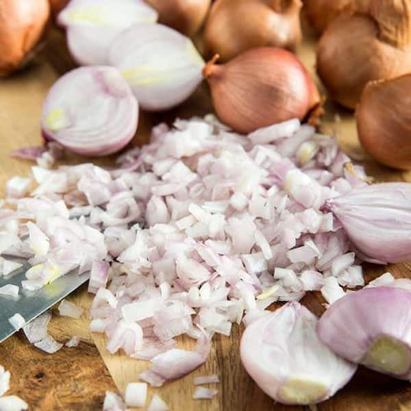 Premium Photo  A sack of garlics shallots and onions