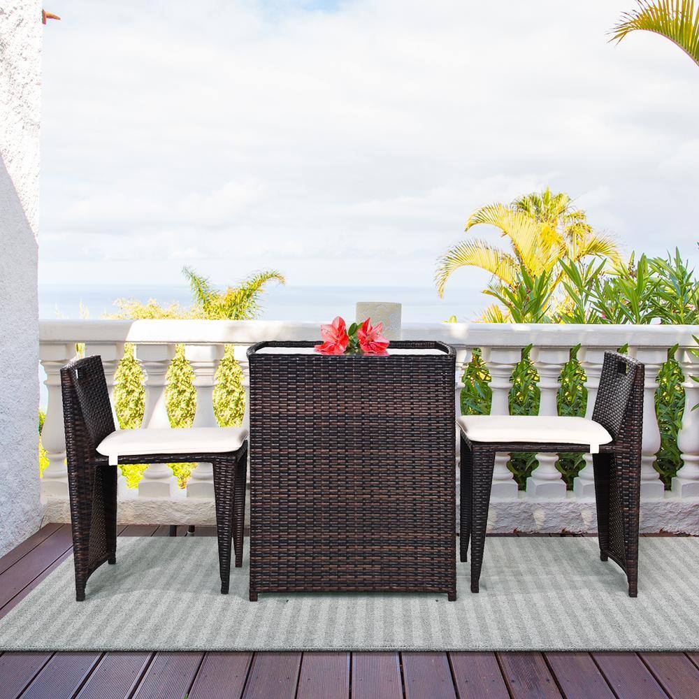 Compact Brown Wicker Outdoor Patio Set with Cushions and Glass Table