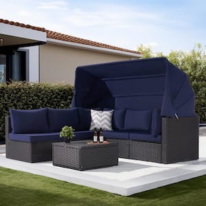 4-Piece Patio Rattan Daybed Set with Retractable Canopy, Navy Blue Soft Cushions and Versatile Coffee Table