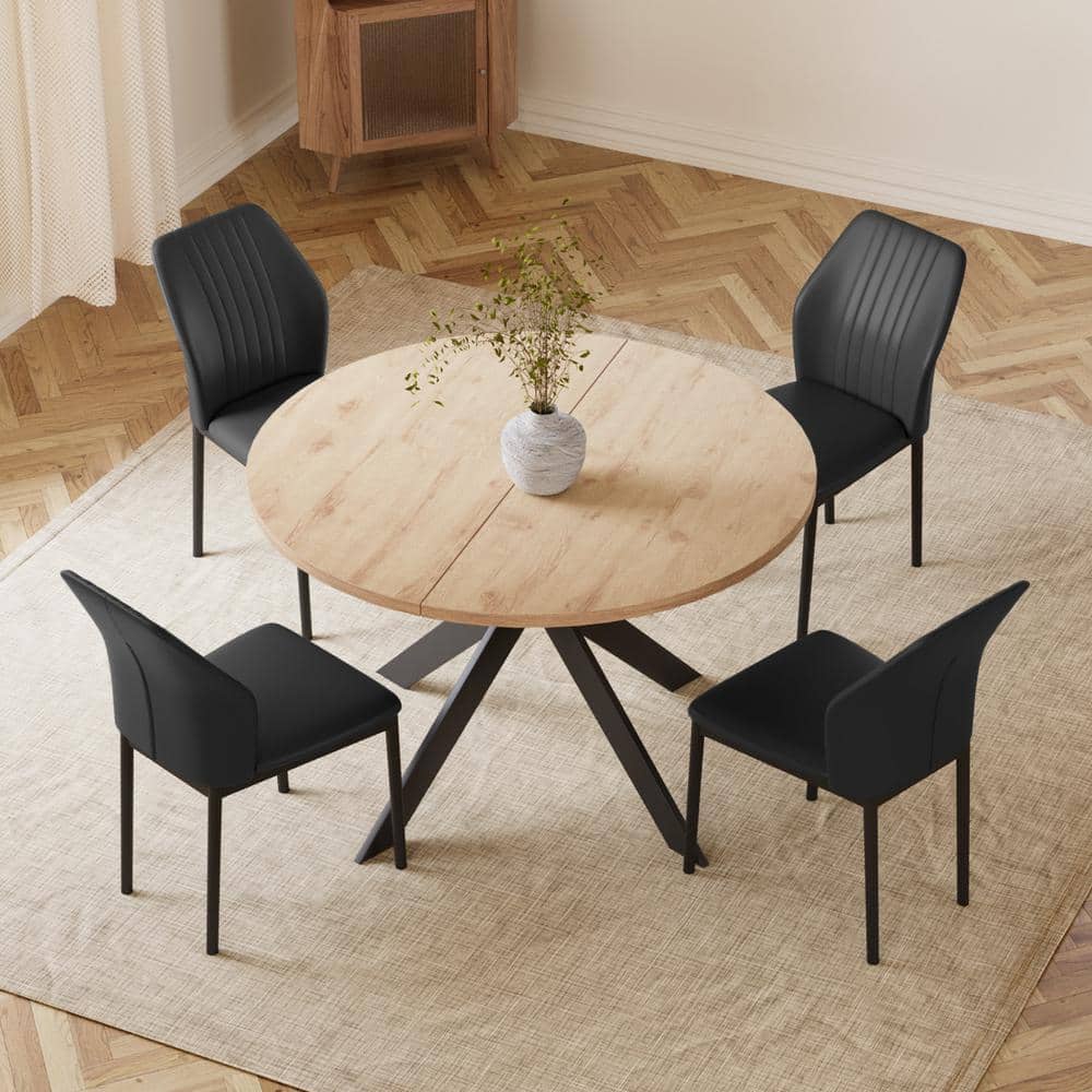 Round wood table with black chairs discount