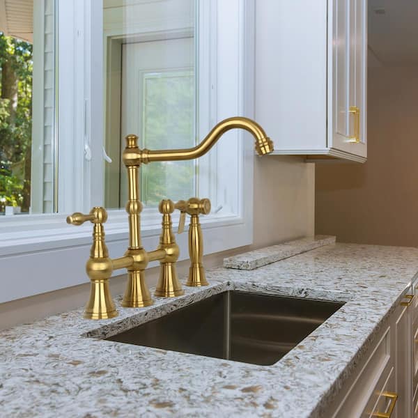 https://images.thdstatic.com/productImages/95352288-c767-4c77-82cb-7b0380ad1f09/svn/brushed-gold-akicon-bridge-kitchen-faucets-ak718-btg-4f_600.jpg