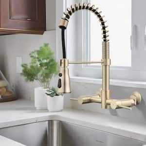 Double-Handle Wall Mounted Bridge Kitchen Faucet with Pull-Down Sprayer Head in Brushed Gold