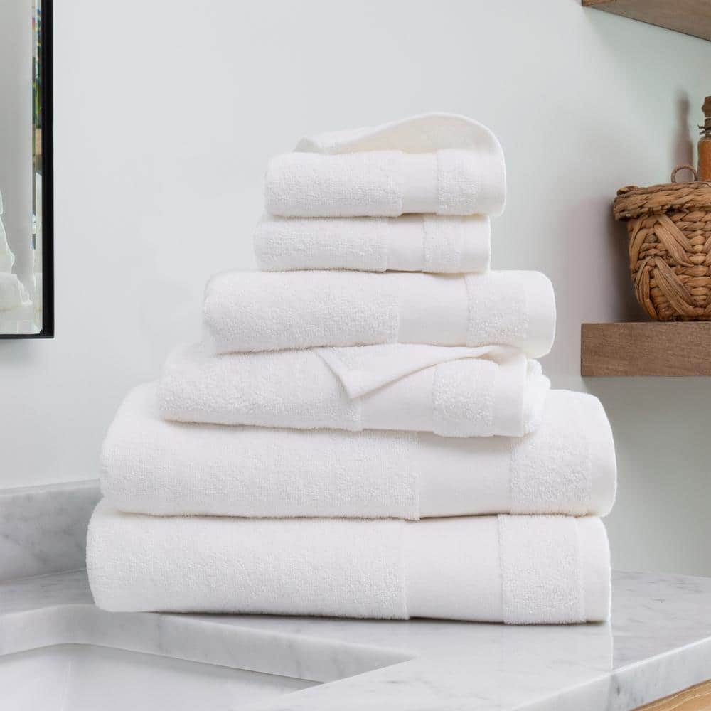 Premium Photo  Towels clean fresh fluffy towels and bath accessories on  table in bathroom