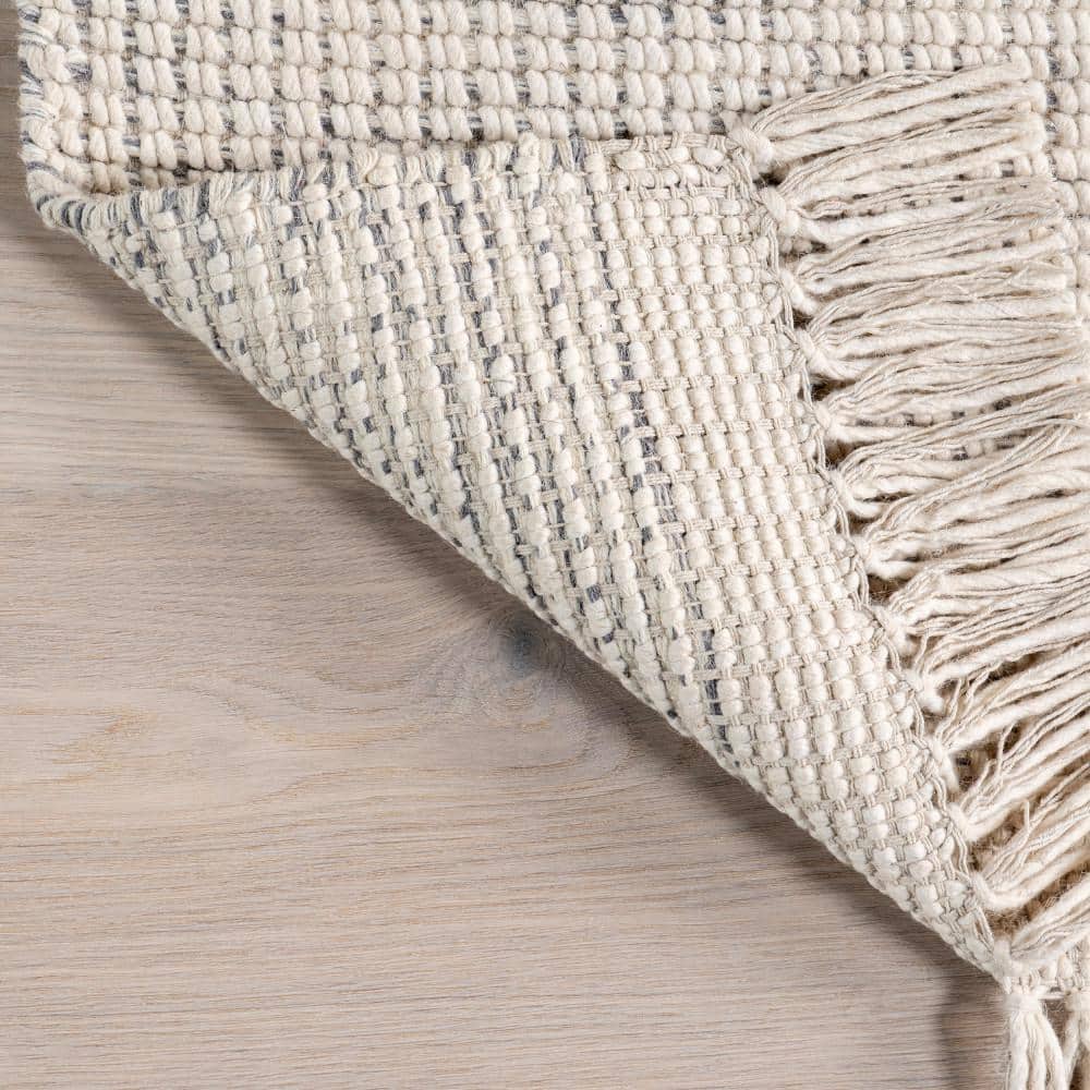 Handmade Ivory Wool Rectangular Area Rug with Fringe