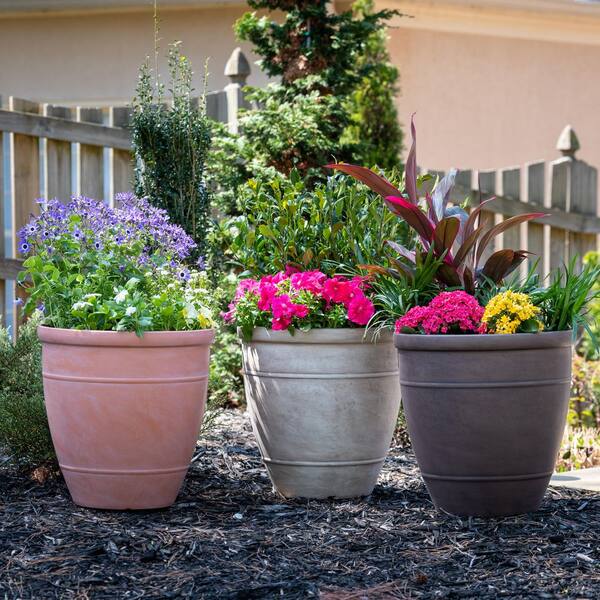 Southern Patio Wright 48.63 qt. Round Plastic Planter in Brownstone (L 18  in. W x 18 in. H x 18 in. ) 10000-03220 - The Home Depot