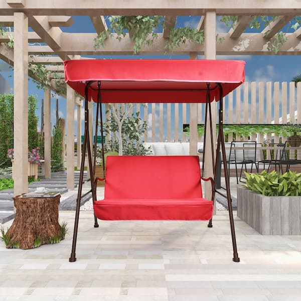 red patio swing with canopy