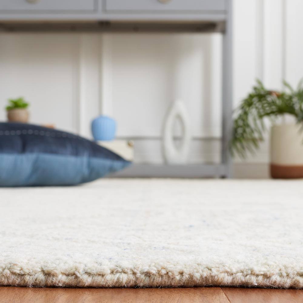 Handmade Blue and Ivory Wool Tufted 8' x 10' Rug