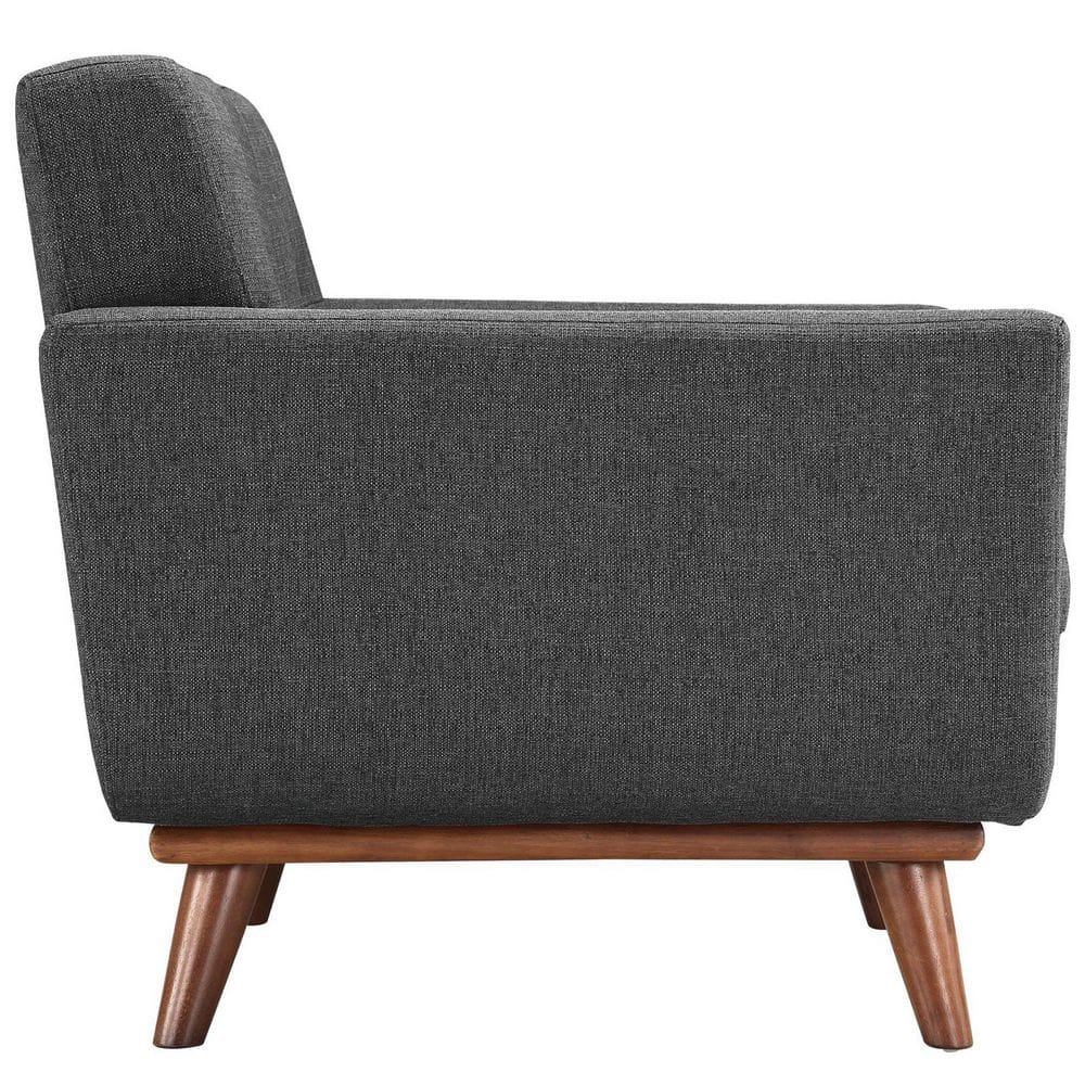 Side view of a modern gray upholstered armchair.