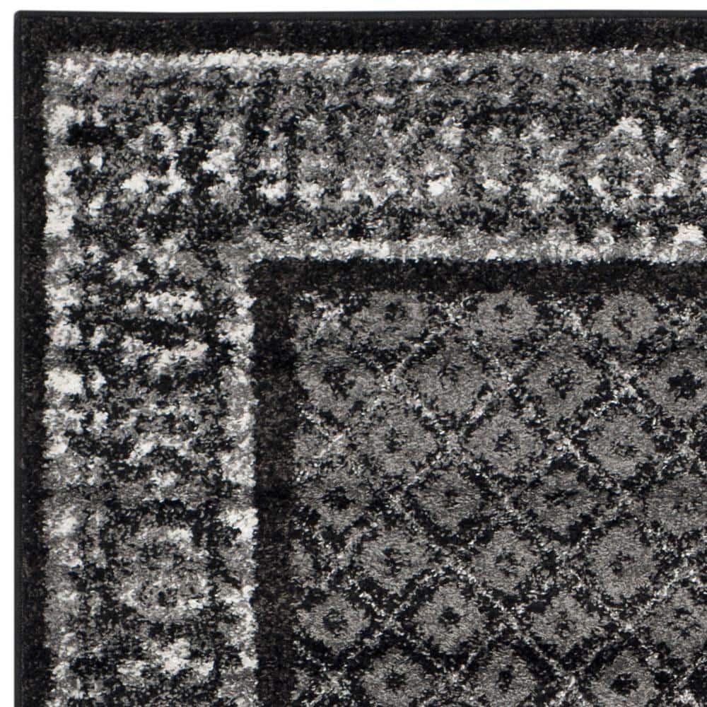 6' x 9' Black and Silver Synthetic Reversible Area Rug