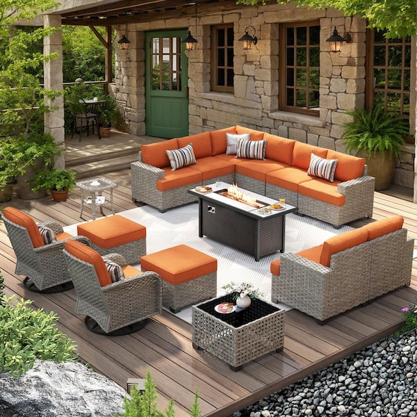 Jubilation 15 Pieces Wicker Outdoor Patio Rectangular Fire Pit Set and Swivel Rocking Chairs with Orange Red Cushions