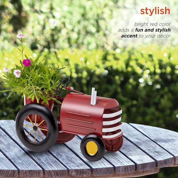 Image of Red tractor flower planter with garden