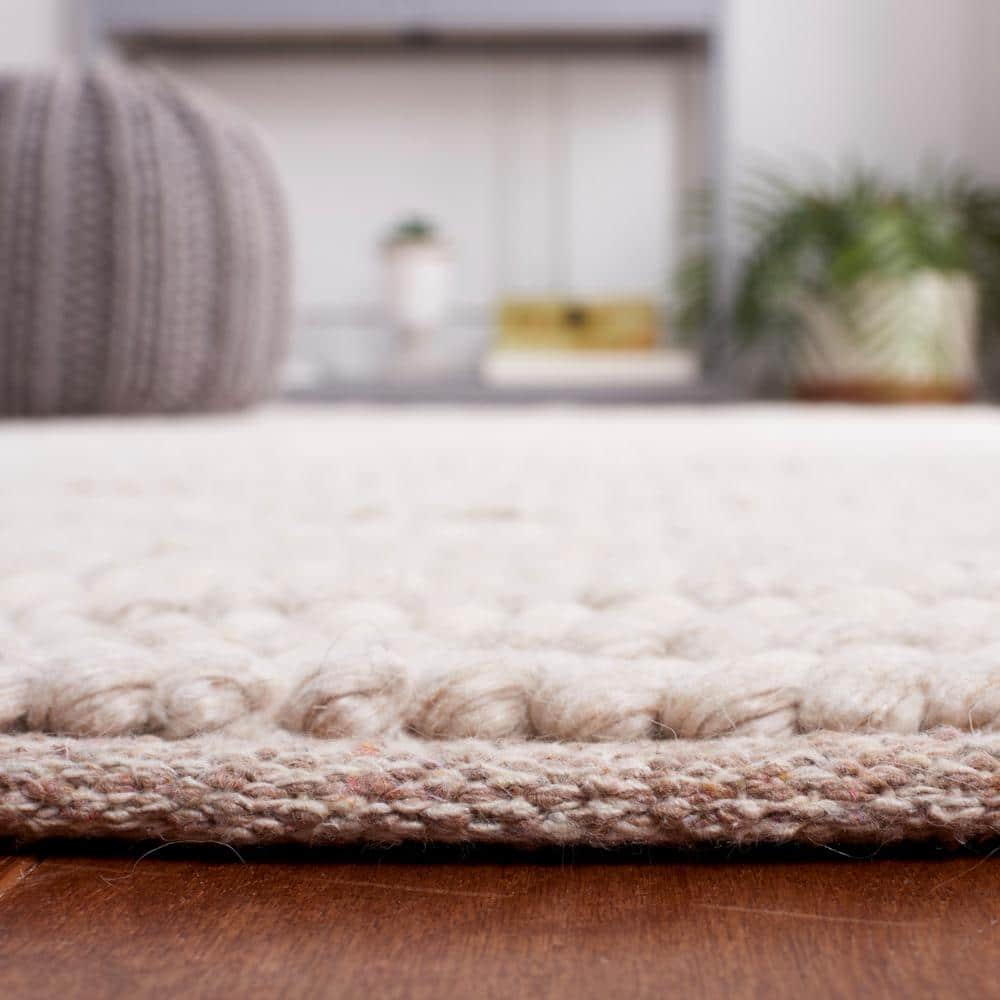 Ivory and Beige 8' x 10' Handwoven Wool and Synthetic Area Rug