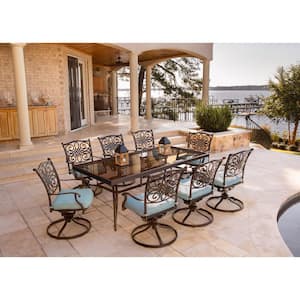 Traditions 9-Piece Aluminum Outdoor Dining Set with Rectangular Glass Table and Swivel Chairs with Blue Cushions