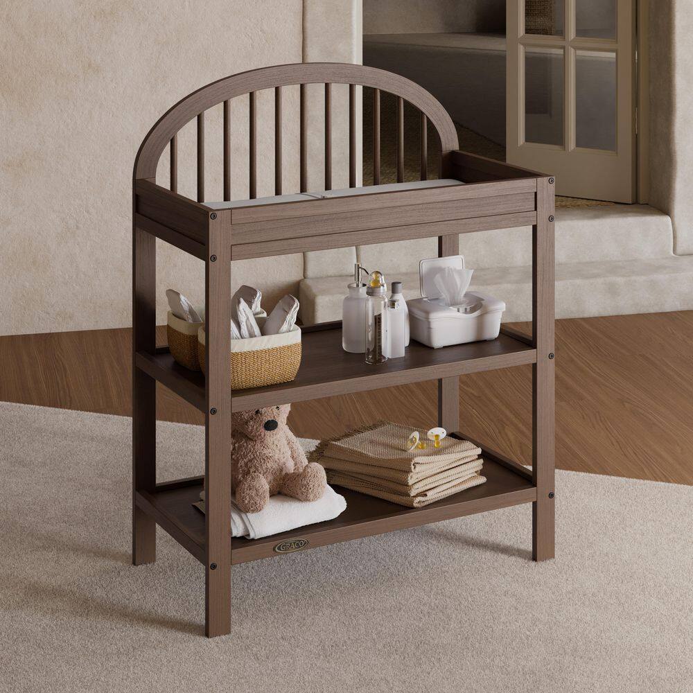 Olivia Hazelnut Changing Table with Water-Resistant Changing Pad