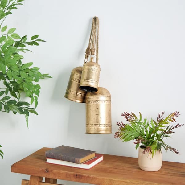 Litton Lane 5 in. x 10 in. Gold Metal Tibetan Inspired Cylindrical Decorative Cow Bell with Jute Hanging Rope (3-Pack)