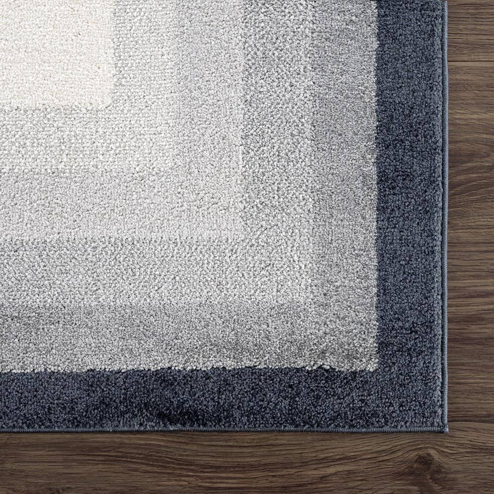 Nuevo 8' x 10' Gray and Cream Synthetic Area Rug