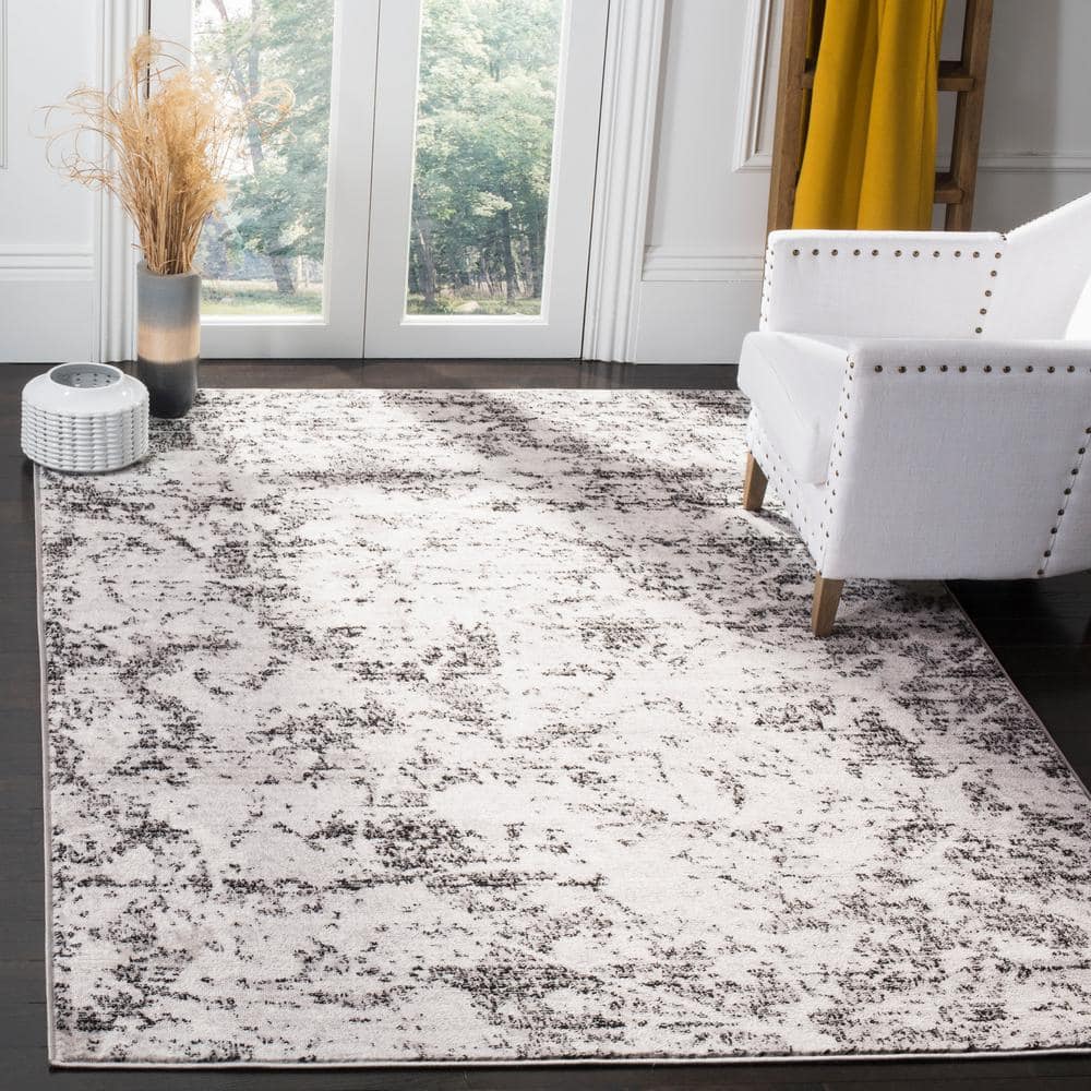 Charcoal and Ivory Abstract Synthetic 5'1" x 7'6" Reversible Area Rug
