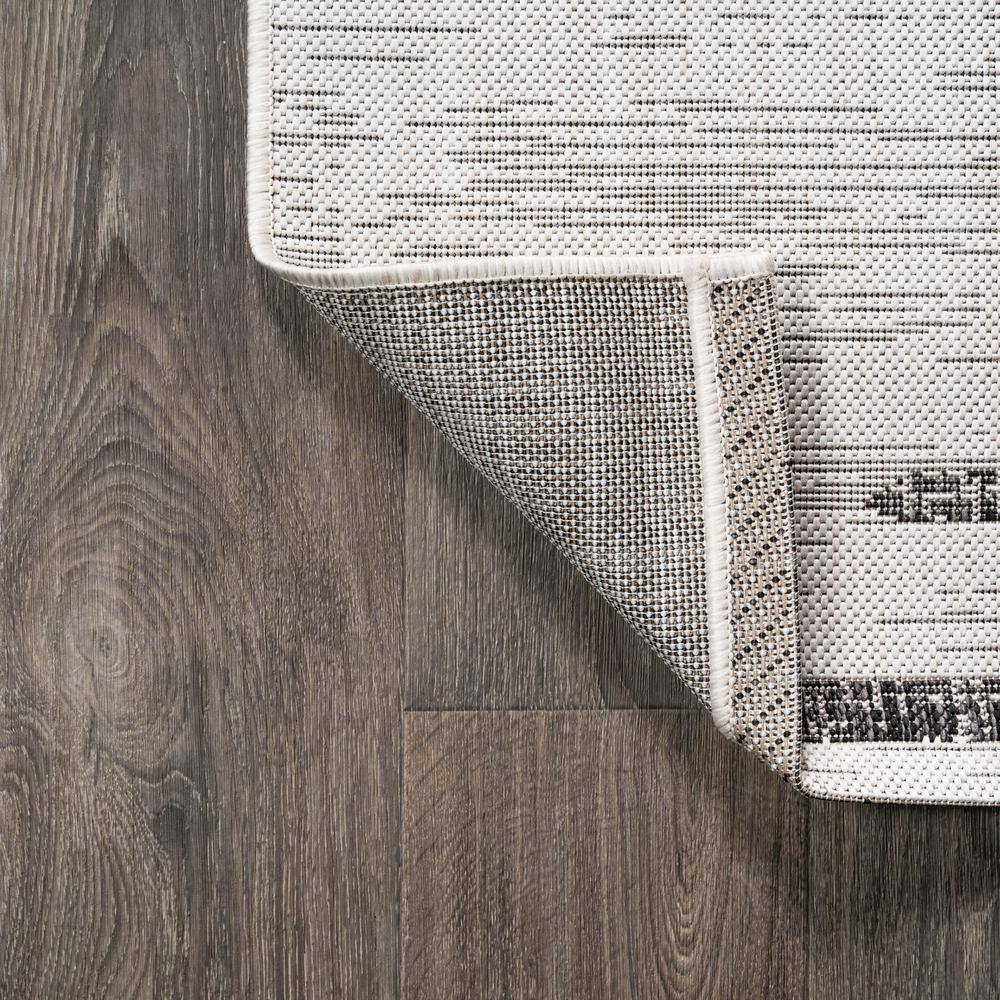 Ivory and Black Striped Synthetic 8' x 10' Reversible Rug
