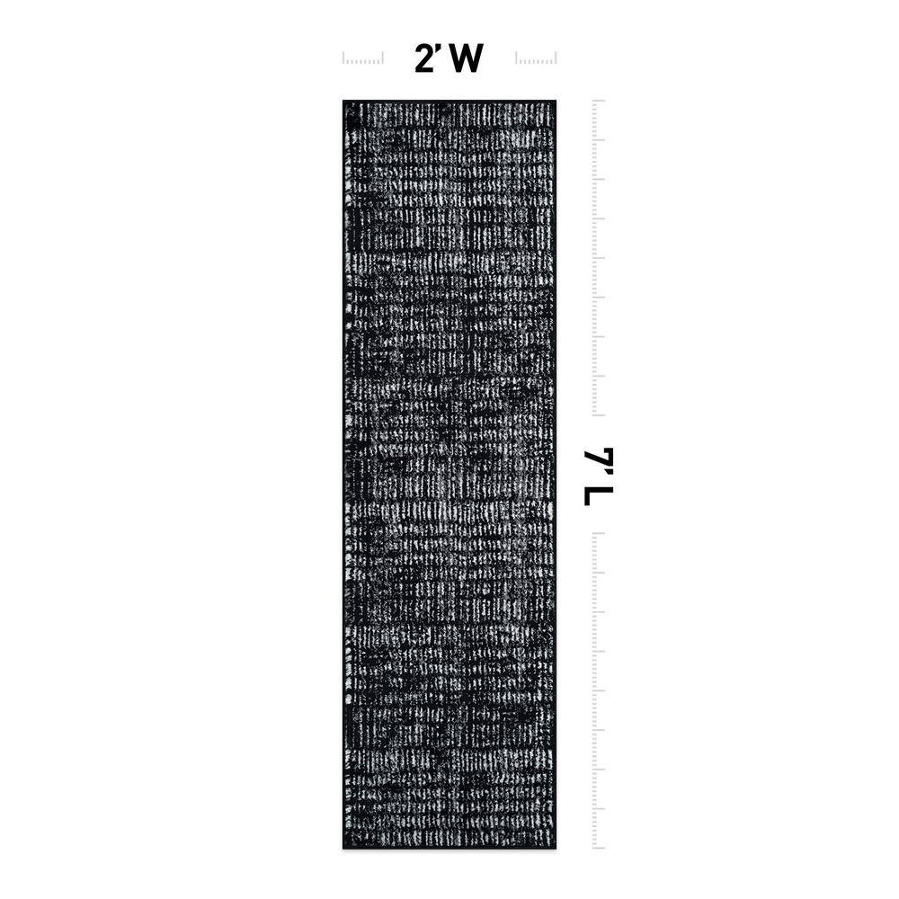Black and Ivory Geometric Polypropylene Area Rug 2' x 7'