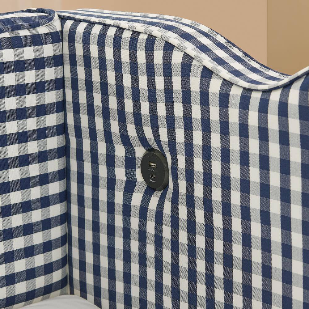Close-up of the built-in USB port on the navy gingham daybed.