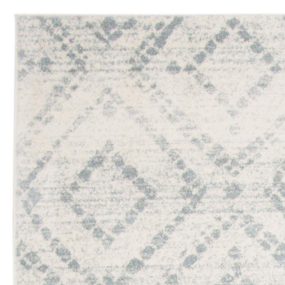 Ivory and Light Blue Geometric 9' x 12' Synthetic Area Rug
