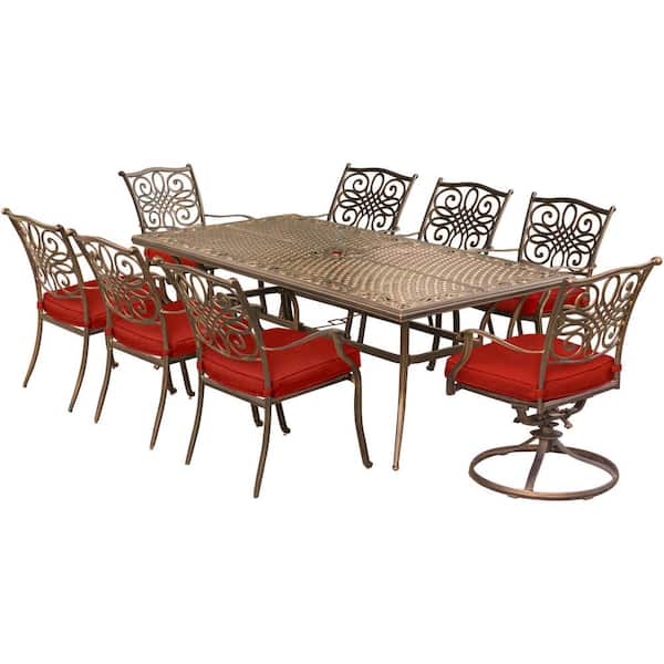 Hanover Traditions 9-Piece Aluminum Outdoor Dining Set with 2 Swivel Rockers with Red Cushions