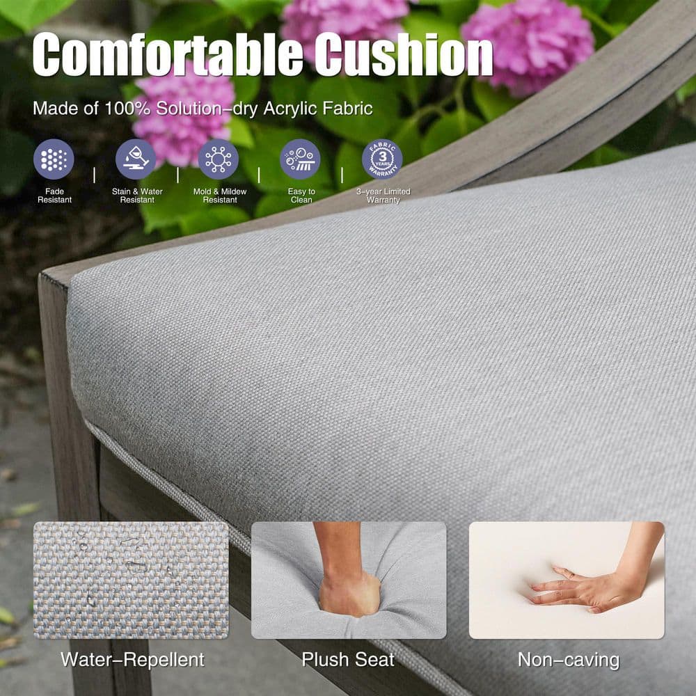 Close-up of a light gray outdoor cushion on a chair.