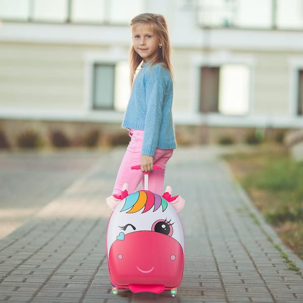 Little girl rolling outlet luggage