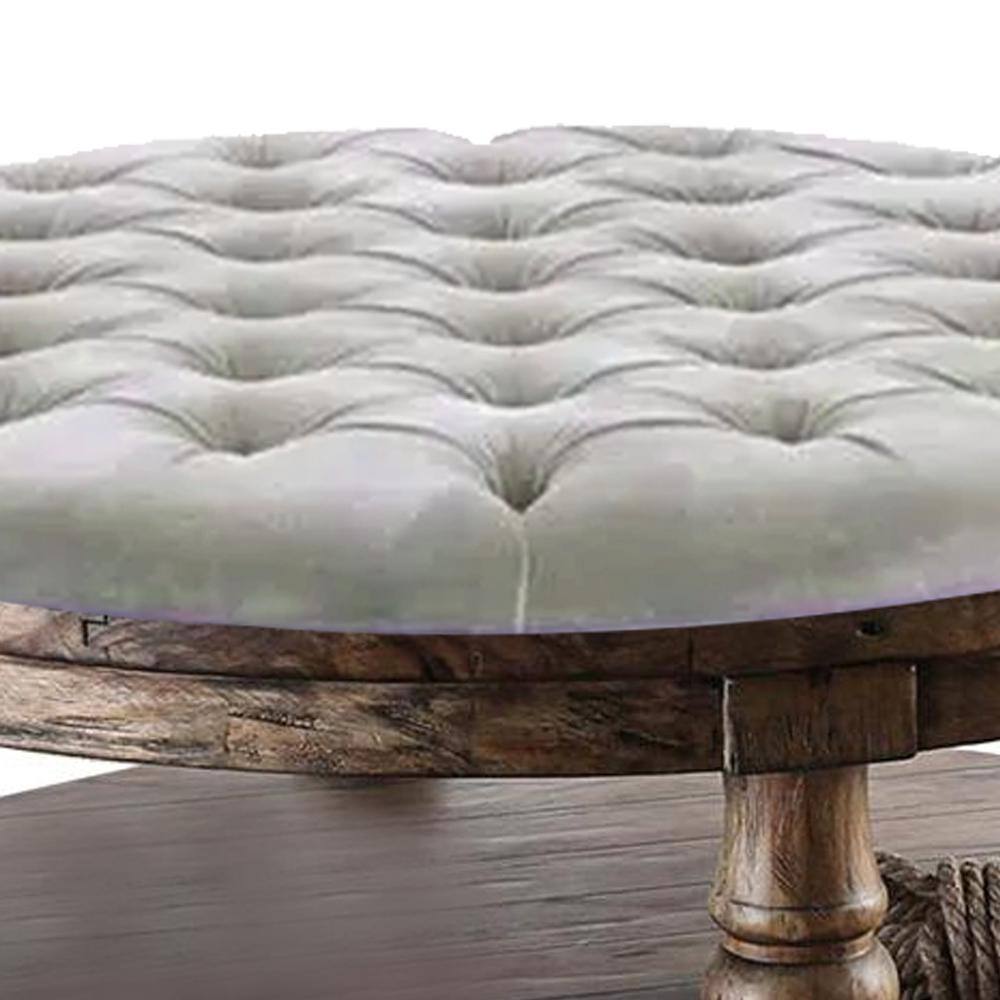 Pastoral Charm Round Oak Coffee Table with Button-Tufted Beige Linen Top