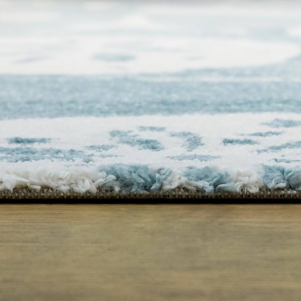 Light Blue and White Synthetic Rectangular 5' x 7' Area Rug