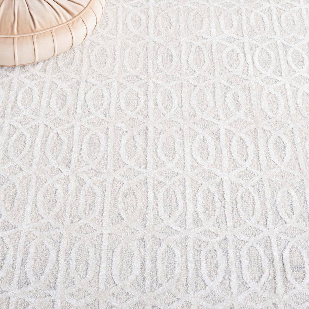 Beige and Ivory Tufted Wool and Viscose 6' x 9' Area Rug