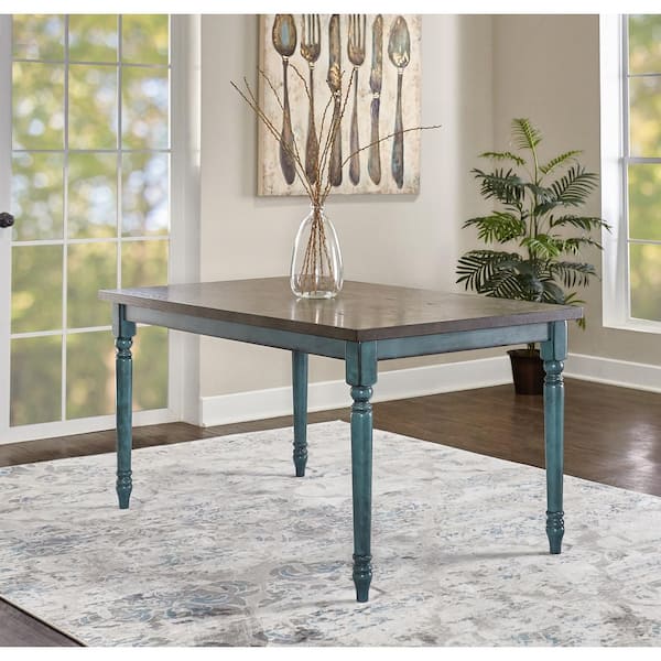 Linon Home Decor Willie Teal Blue wood top 59.06 in. W 4 legged Dining Table 6 person seating capacity