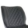 Close-up of the diamond-stitched pattern on the backrest of a black bar chair.