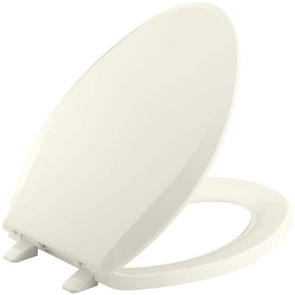 KOHLER Cachet Elongated Closed Front Toilet Seat with Q2 Advantage in Biscuit