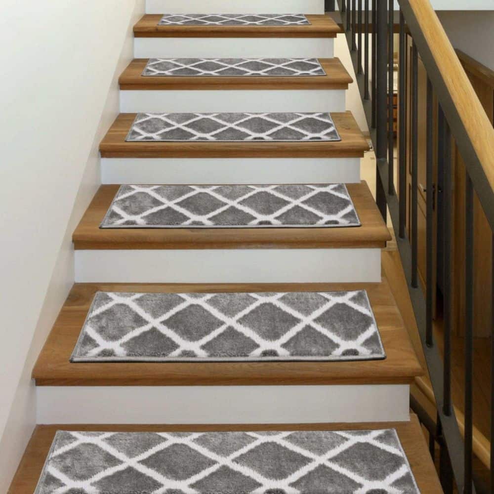 https://images.thdstatic.com/productImages/98f629b6-3a6d-4dde-82a1-9bcb7ee424ab/svn/gray-the-sofia-rugs-stair-tread-covers-stair-64b-gr-5-64_1000.jpg