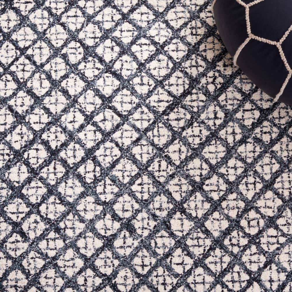 Ivory and Navy Tufted Wool Abstract Area Rug