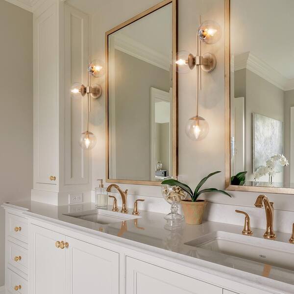 bathroom with sconces