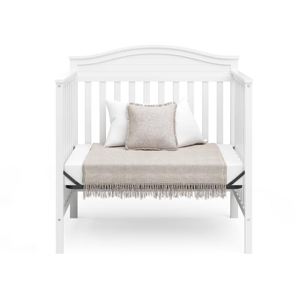 Stella White Pine Wood 4-in-1 Convertible Mini Crib with Foam Mattress