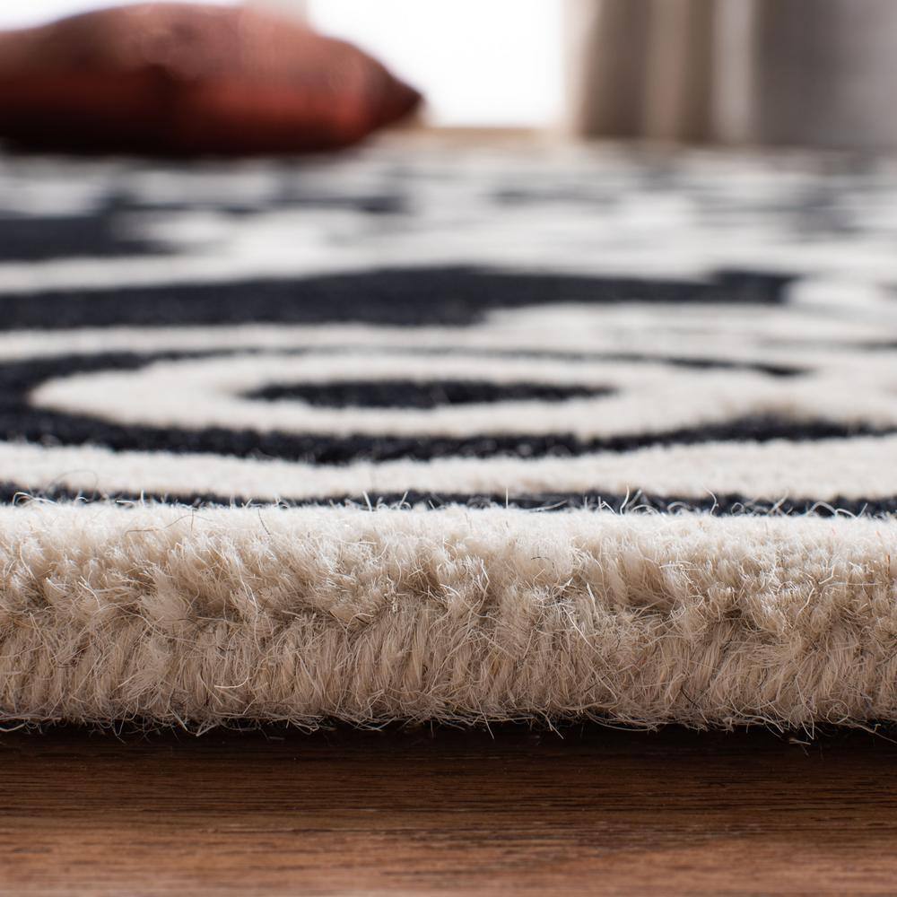 Handmade Black and Ivory Wool Viscose Tufted Area Rug