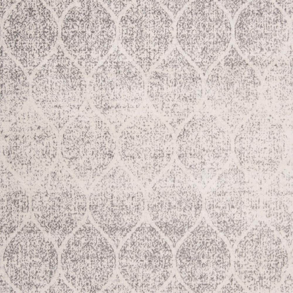 Ivory and Silver Geometric 8' x 10' Synthetic Area Rug