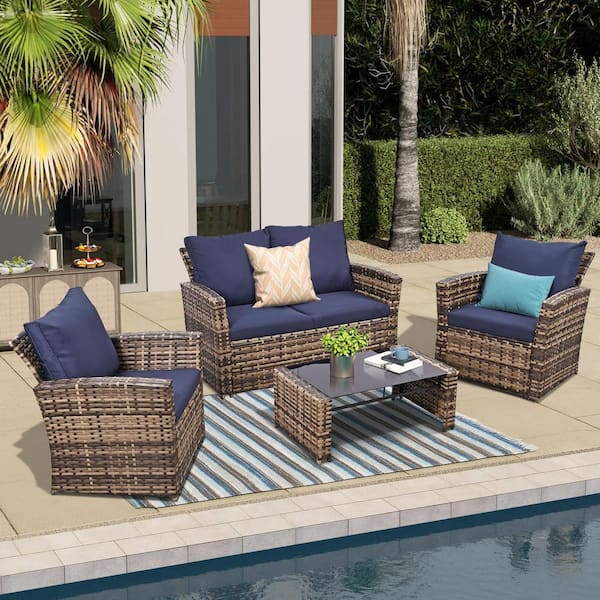 Zeus & Ruta 4-Piece Brown Outdoor Wicker Conversation Sets with Blue Cushions and Coffee Table for Outside