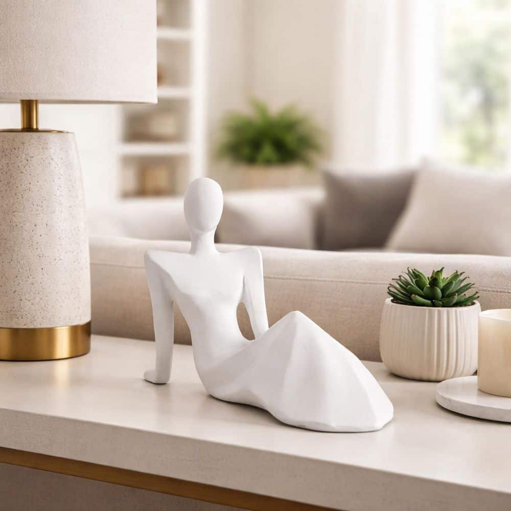 White 11 in. x 8 in. Ceramic Transitional Reclining Human Statue