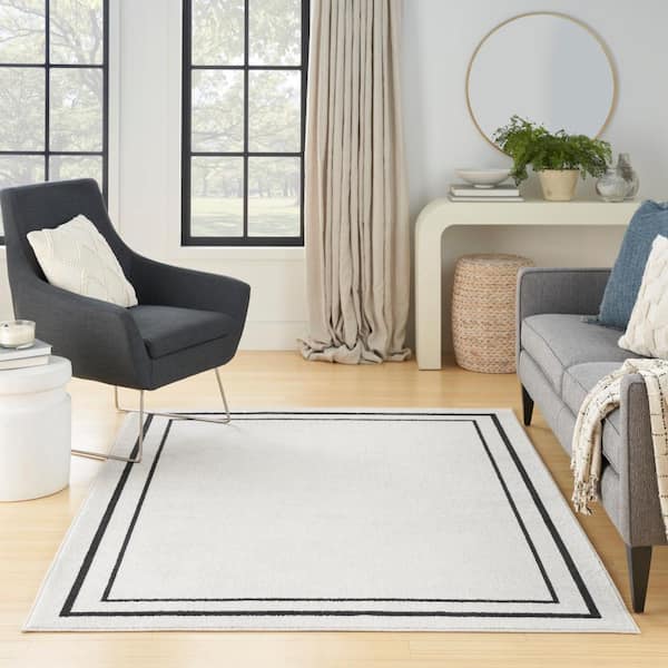 https://images.thdstatic.com/productImages/9a6f5e73-ff8f-5e6f-9e6c-b8a7b2cf525e/svn/ivory-black-nourison-area-rugs-148308-4f_600.jpg