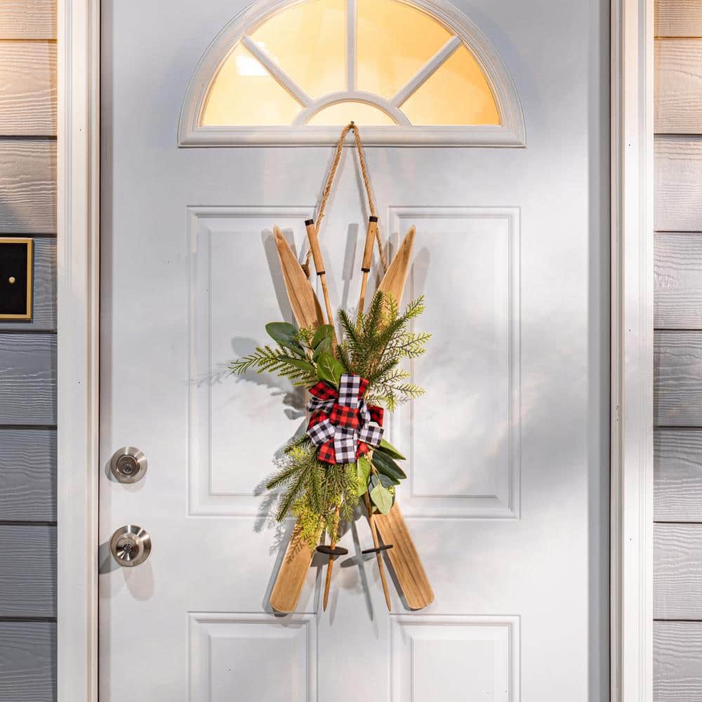 26-Inch Natural Wood Ski Wall Hanging with Plaid Bow and Greenery