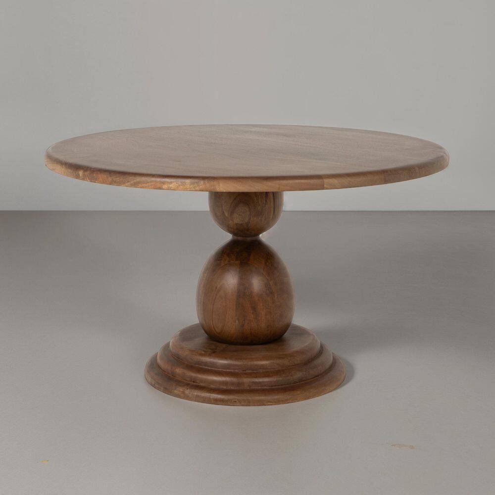 Three-quarter view of the Kennedy 30-inch Walnut Finish Round Mango Wood Bulbed Pedestal Coffee Table.
