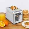 https://images.thdstatic.com/productImages/9a8029e9-ab37-49c4-beb8-97fe53f99735/svn/stainless-steel-kalorik-toasters-to-50665-ss-31_100.jpg