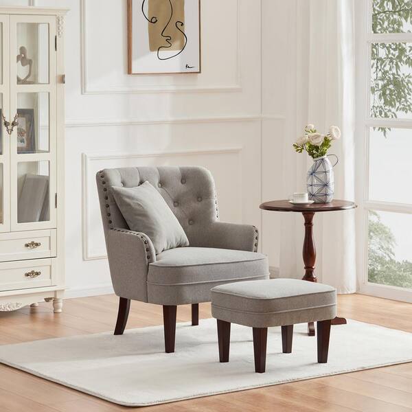 tufted accent chair and nailhead ottoman