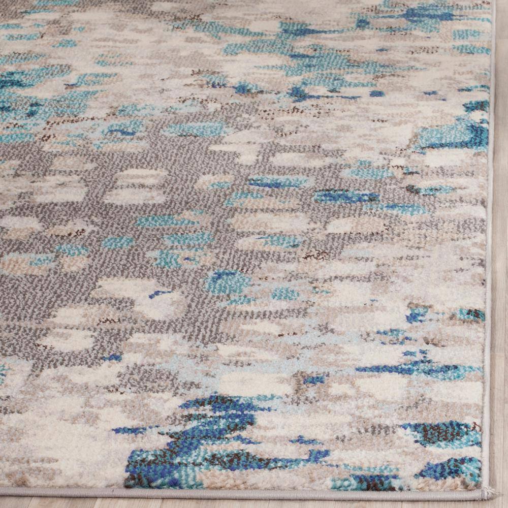 Boho-Chic Gray Geometric Synthetic 10' x 14' Area Rug