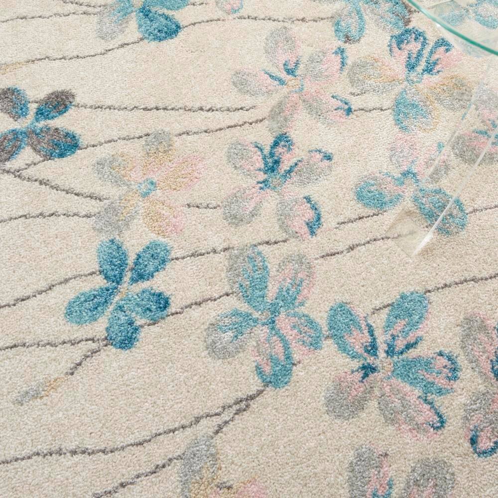 Ivory Floral Bliss Synthetic 5'3" x 7'3" Round Area Rug
