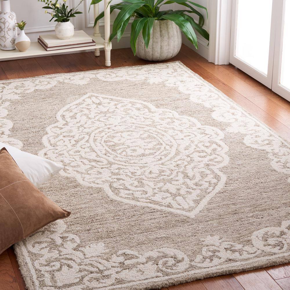 Handmade Ivory Abstract Tufted Wool Round Rug